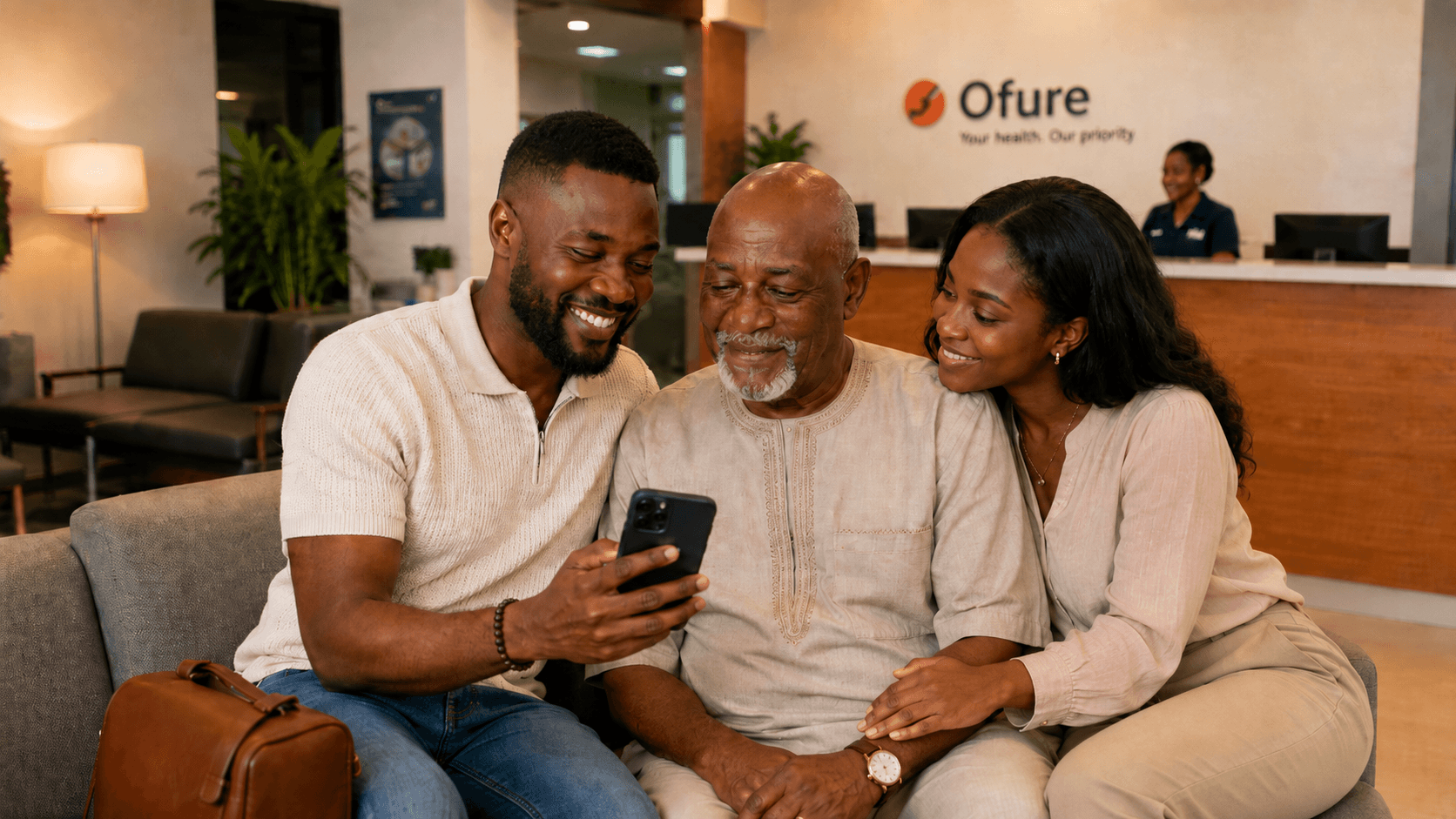 A family reviewing a health plan together inside an Ofure clinic.